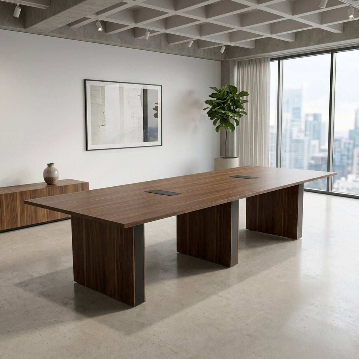 Modern conference table in California Walnut with three panel legs and two closed power grommets in an office with city windows