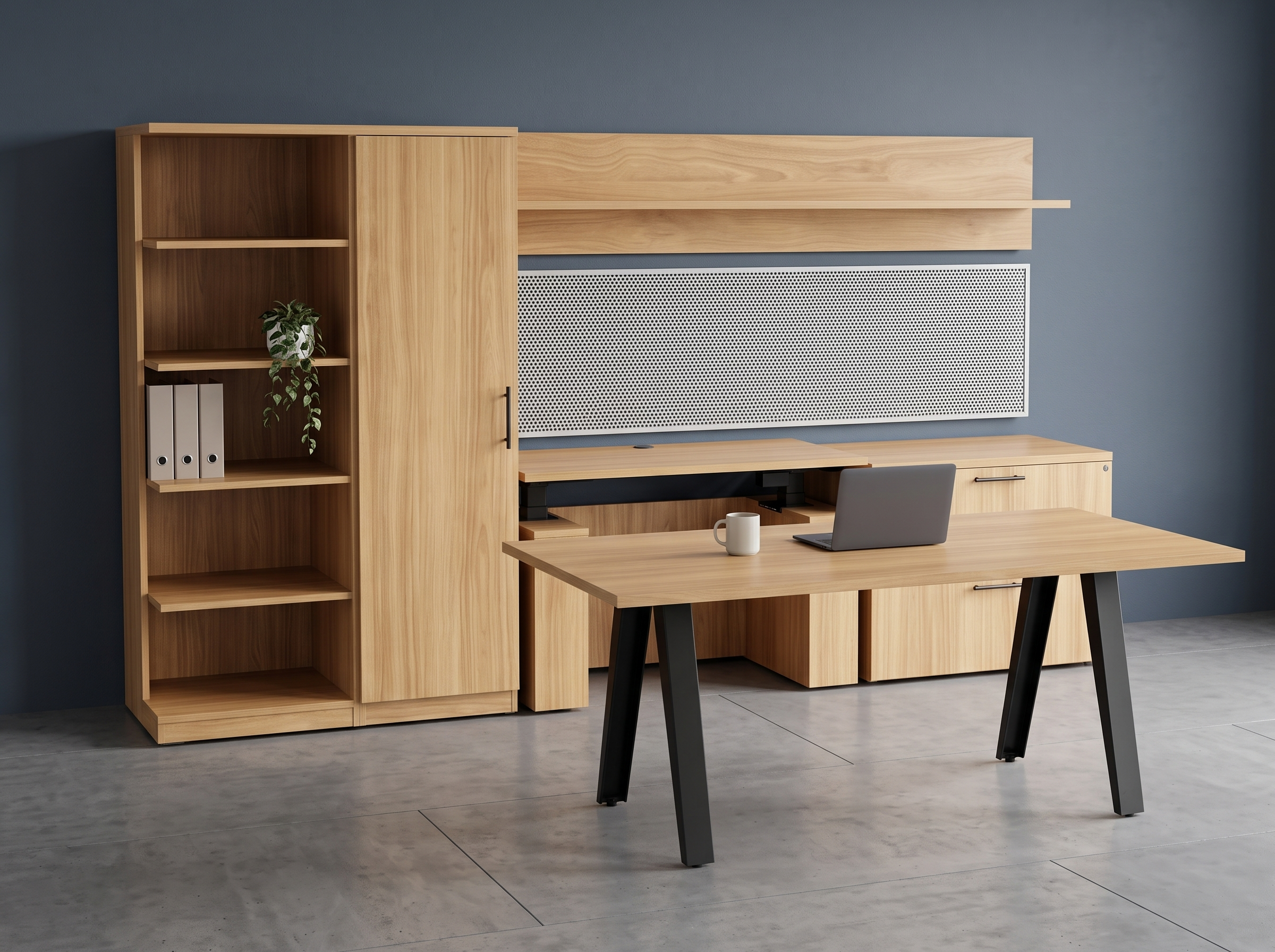 Light oak table desk angled in front of a wall unit with bookcase and wardrobe, navy wall