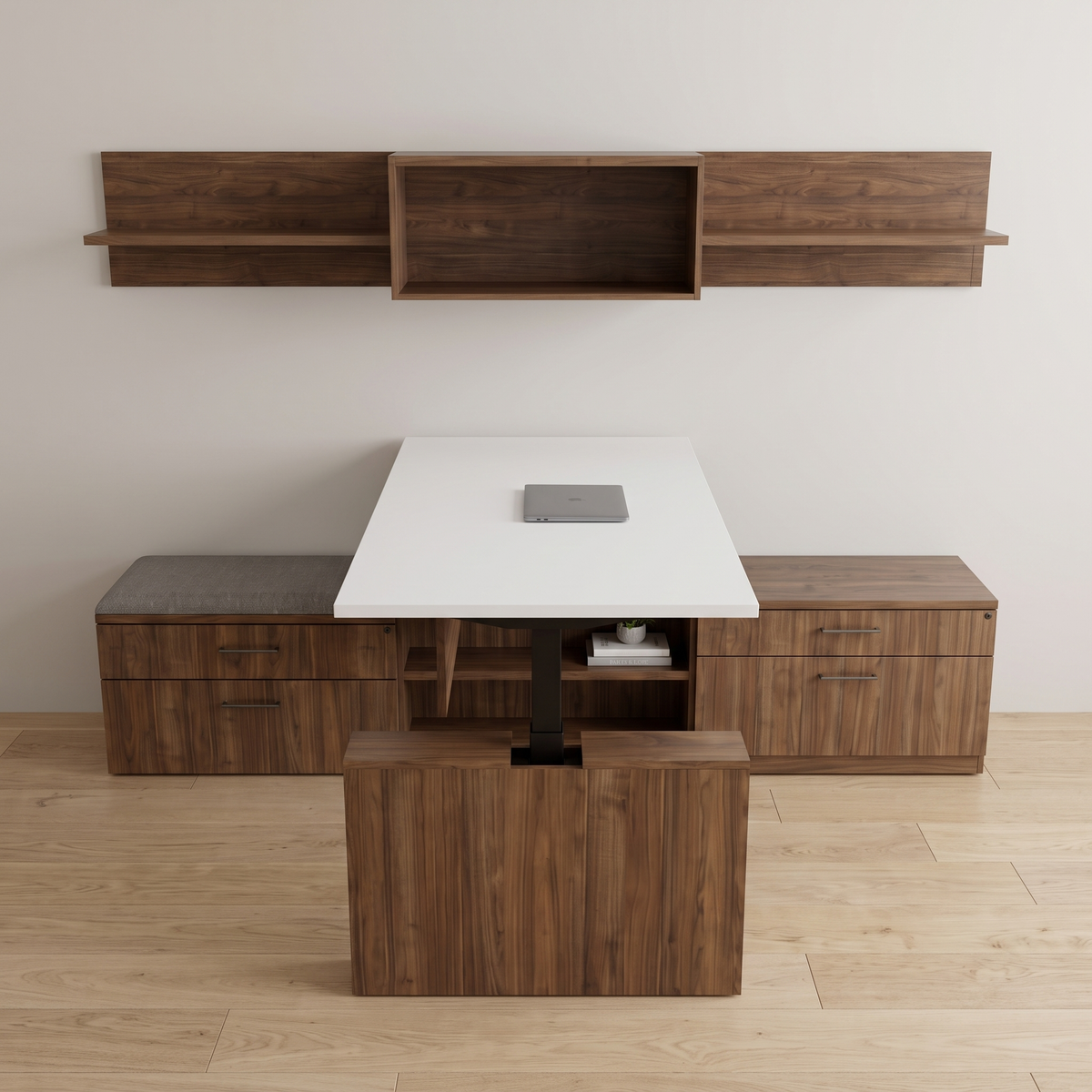 Front view of a height adjustable desk carried on a storage cabinet with a gray cushioned bench