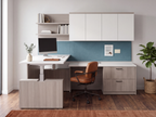 L shaped standing desk with hutch and shelves in a home office with a cognac leather chair
