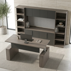 Elevated view of a gray sit-stand desk facing a storage wall with credenza, hutch and bookcases