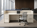 Reception desk with lockable drawers and navy ledge in a leather-seated law firm lobby