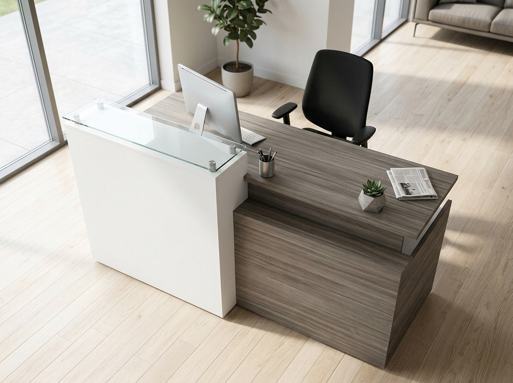 Overhead view of the gray reception desk showing the glass counter and work surface
