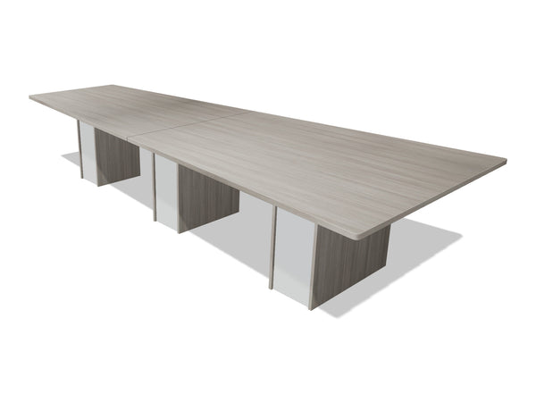 Tenure 12 ft tapered conference table in Iron Hemlock II, a light grey woodgrain laminate, three-quarter view on white