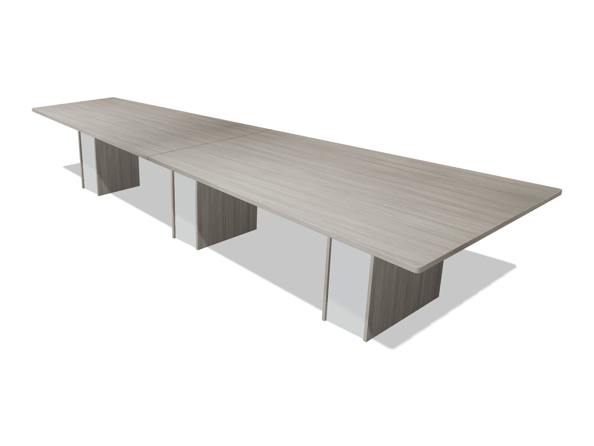Tenure 14 ft tapered conference table in Iron Hemlock II, a light grey woodgrain laminate, three-quarter view on white