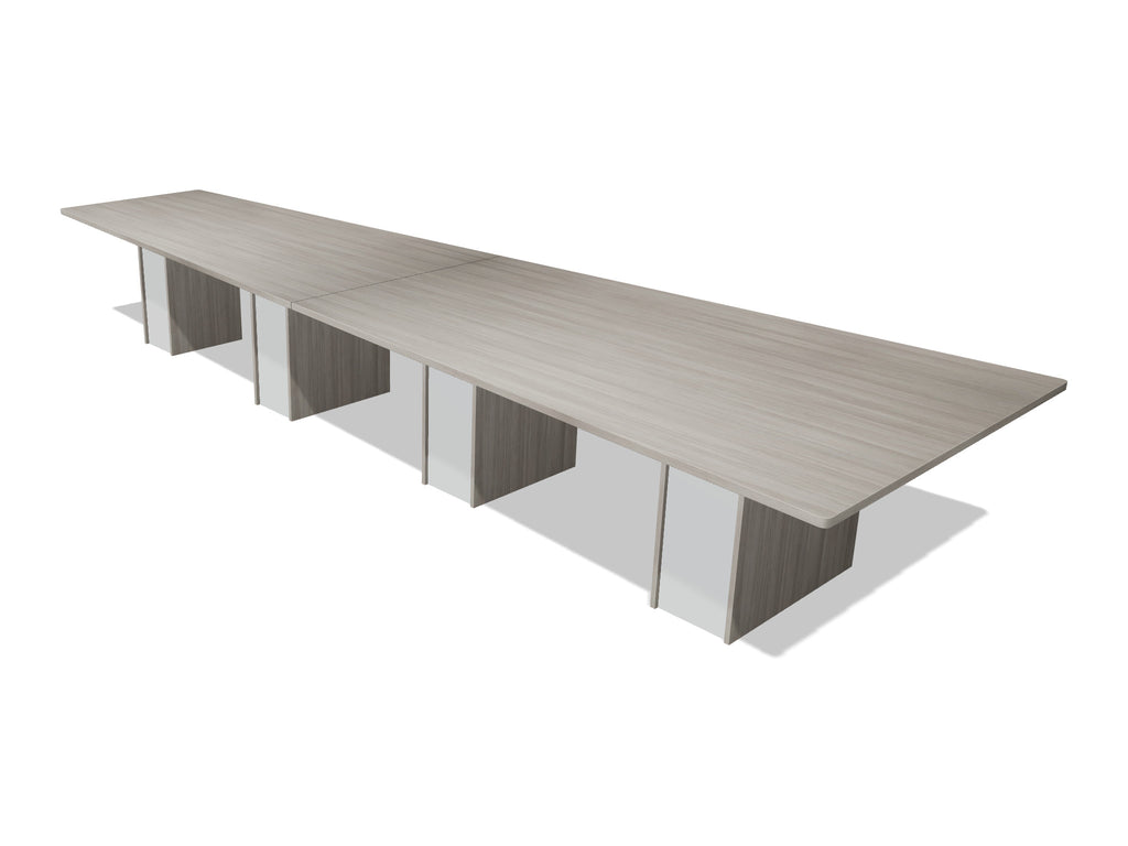 Tenure 16 ft tapered conference table in Iron Hemlock II, a light grey woodgrain laminate, three-quarter view on white