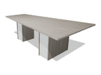 Tenure 8 ft tapered conference table in Iron Hemlock II, a light grey woodgrain laminate, three-quarter view on white