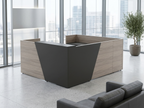 Overture U-shaped reception desk with storage in gray woodgrain and an angled charcoal panel