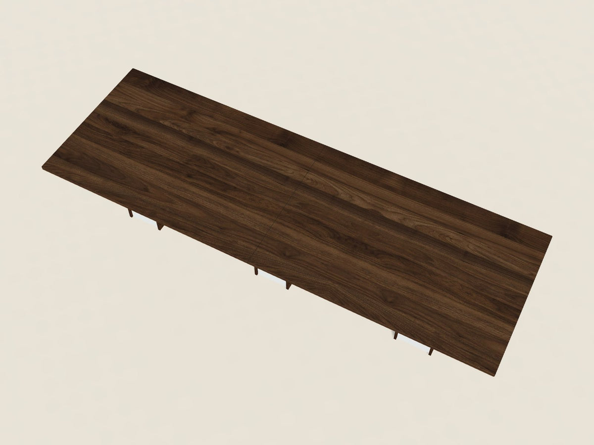 Rectangular conference table in California Walnut, a dark walnut brown woodgrain laminate, seen from above